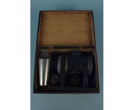 A boxed magic lantern with original oil lamp fittings plus fifteen lantern slides