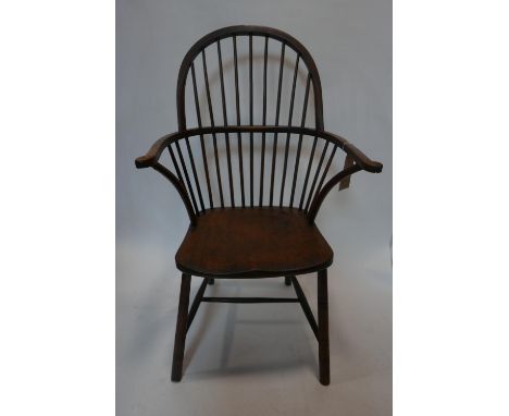 A late 19th century Windsor chair, with stick back on turned legs joined by stretchers 