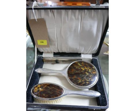 A boxed vintage dressing table set to include a silver plated and faux tortoiseshell hand mirror 26cm, matching hairbrush, 25