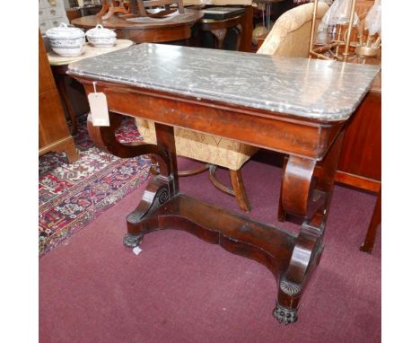 A 19th century French Louis Philippe flame mahogany console table, with gray marble top, scroll supports, raised on lion paw 