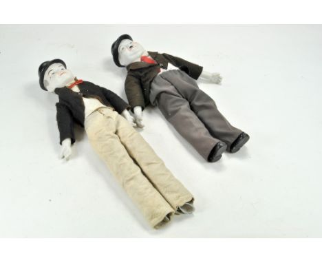 Ceramic duo of Vintage Laurel and Hardy Dolls with clothes.