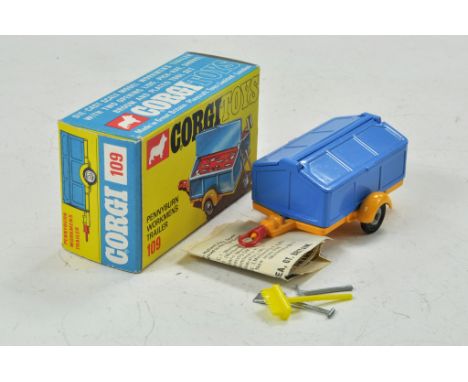 Corgi Toys No. 109 Pennyburn Workmen's Trailer. Blue body with a yellow chassis and base. Tools include a shovel, Pick-axe an