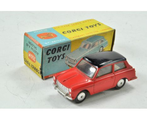 Corgi No. 216M Austin A40 with flywheel motor (works well). Red body with black roof. Grey base and flat spun hubs. Appears e