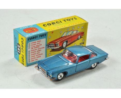 Corgi No. 241 Chrysler Ghia L.6.4. Metallic silver blue body with red interior. Shaped hubs and Corgi dog figurine on rear sh