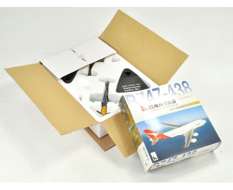Duo of diecast model aircraft with boxes.