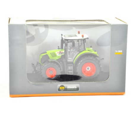 Universal Hobbies 1/32 Farm issue comprising Claas Arion 540 Tractor. Excellent, secured in box, not displayed.