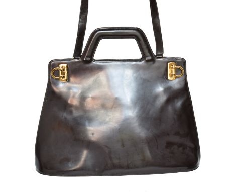 A Salvatore Ferragamo bag, the brown smooth leather exterior with gold tone hardware, clip fastening and shoulder strap, make