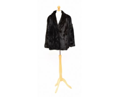 A Saga Mink fur coat, the short length mink fur coat with hook fastening, labelled size 14.Condition report: Overall conditio