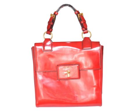 A Prada Spazzolato Gusset bag, the red patent leather exterior with top flap closure, gold-tone hardware with maker's logo an