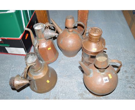 Four Middle Eastern copper teapots; together with a copper lantern. (5)