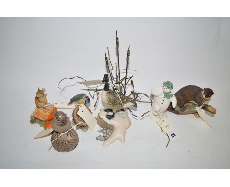A Royal Doulton figure titled "The Snowman"; a Poole ware model of a blue-tit sitting on a pine cone; and four Border Fine Ar
