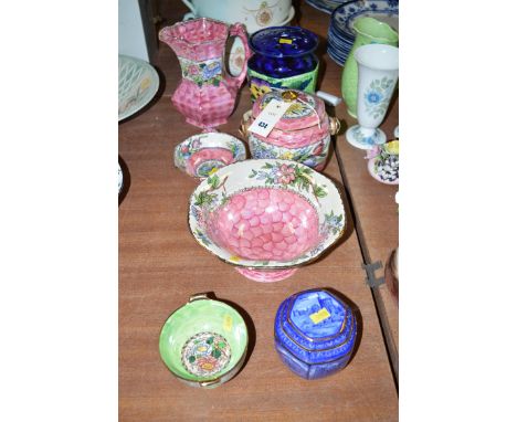 A collection of Maling ware, comprising: three bowls; a tea caddy; biscuit barrel; flower vase; jug; and biscuit barrel.
