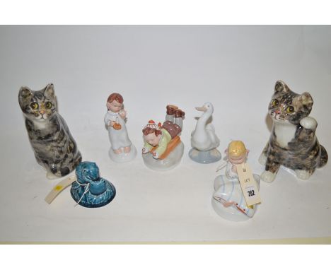 Three Royal Dux figures of children; a Nao goose; a Poole ware mouse; and two porcelain cats with glass set eyes.