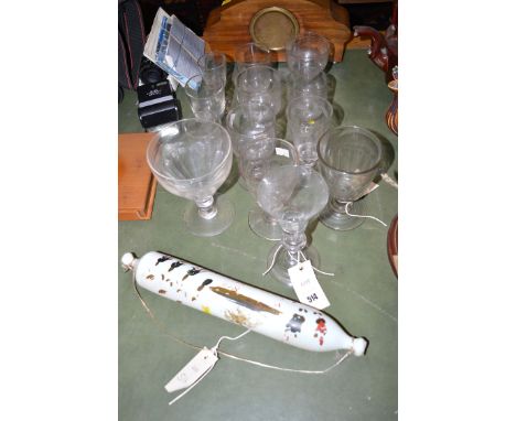 A collection of various thirteen antique glasses; and an opaque glass rolling pin with painted decoration (distressed).