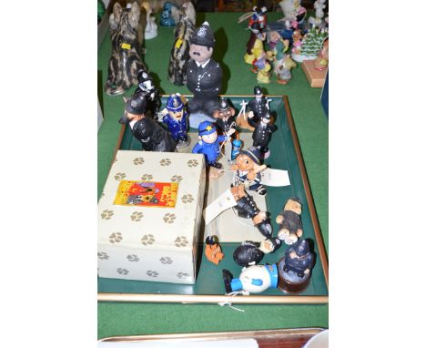 A quantity of policemen figures by Honeysuckle, Camberwick Green, Royal Worcester, Pendelfin and others.