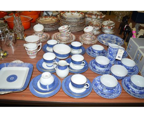 A Wedgwood twenty-one piece afternoon tea set, decorated with blue border, gilded highlights on white ground; together with a