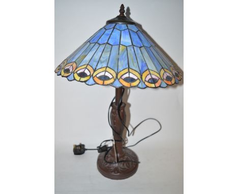 A reproduction Tiffany style table lamp, with conical shade in blue and yellow, on Art Nouveau style base.