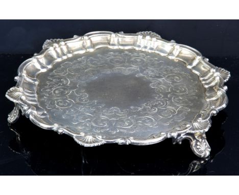 Victorian silver waiter with engraved decoration and shell and scroll border, on three shaped feet, by Henry Wilkinson & Co.,