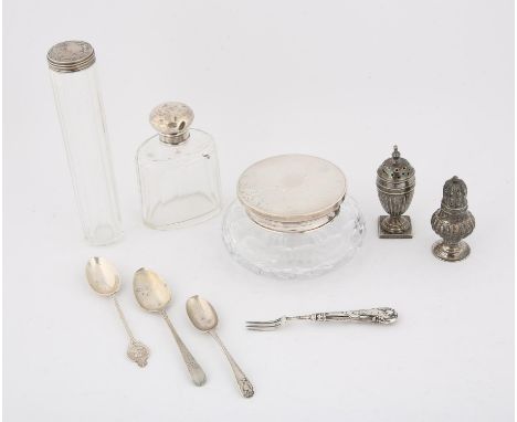 Three silver topped dressing table jars, three teaspoons, silver handled pickle fork and a two pepperettes with filled bases,