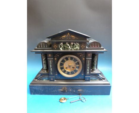 A Victorian slate mantel clock with marbled decoration in Romanesque style, gilt dial and black chapter ring, movement by L. 