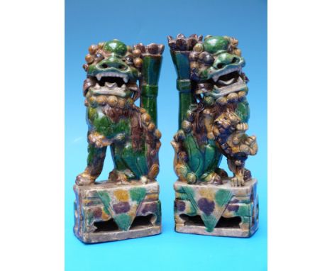 A pair of Chinese Kangxi (1662-1722) famille verte Foo Dogs 