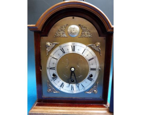 A Dutch chime Elliott bracket clock with brass dial and cherub spandrels including bracket shelf