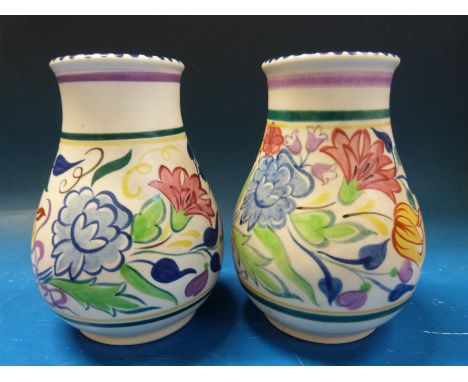 A near pair of Poole vases