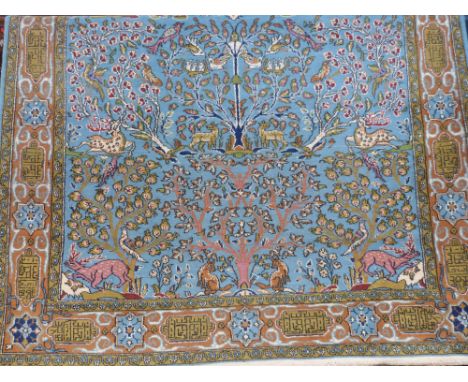 A Persian wool carpet on blue ground with tree of life decoration (L210 x W148cm)