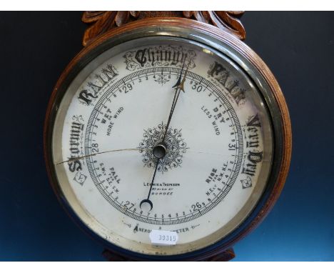 An early 20thC aneroid barometer with mercury thermometer dial marked Lennie & Thomson Dundee