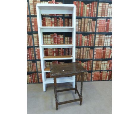 A painted shelf unit together with an occasional table