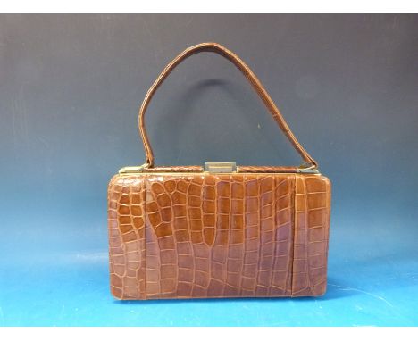 A vintage crocodile skin handbag