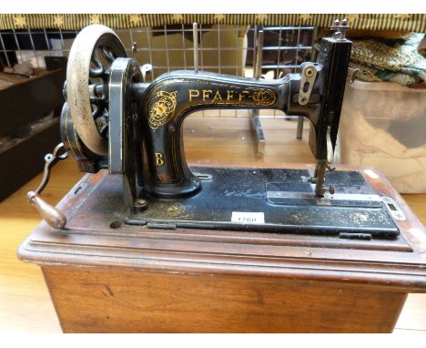 A vintage Pfaff sewing machine in case 