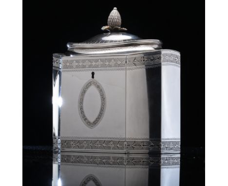 A Georgian hallmarked silver tea caddy, of neoclassical form with incuse corners, shaped lid and bright cut decoration, Londo