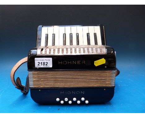A Hohner 'Mignon' 8 bass children's accordion finished in black (tiny but not a toy)