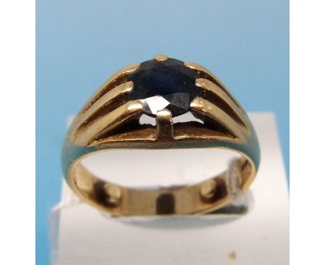 An 18ct gold ring set with a large sapphire (size Q)