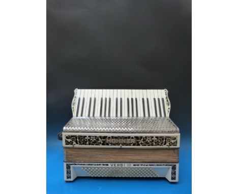 A Honner 120 brass Verdi III c1930s piano accordion in ivory coloured finish, in soft rucksack case