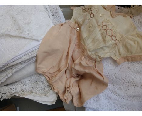 A quantity of vintage lace, linen and unused bolts of fabric
