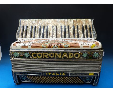 A highly decorated 'Coronado Italia' 120 bass piano accordion, diamanté to case and C bass button plus floral embellishments 