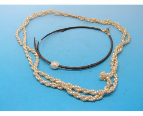 A seed pearl necklace with gold clasp and a bracelet with a natural pearl 