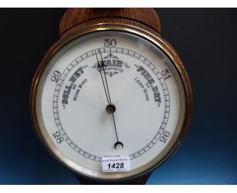 An early 20th century aneroid oak banjo barometer 