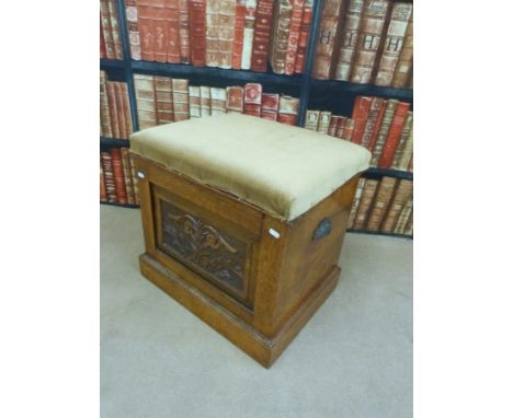 A 19thC carved oak commode, width 56cm 