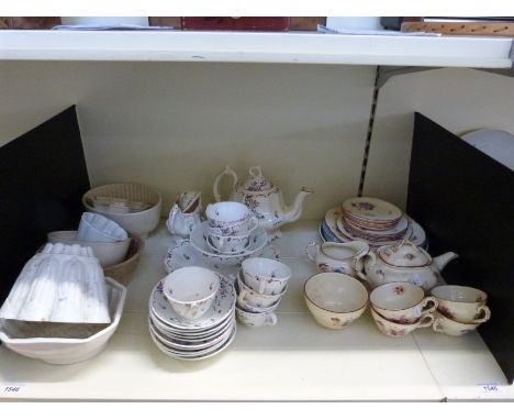A collection of ceramics to include jelly moulds and a tea service 