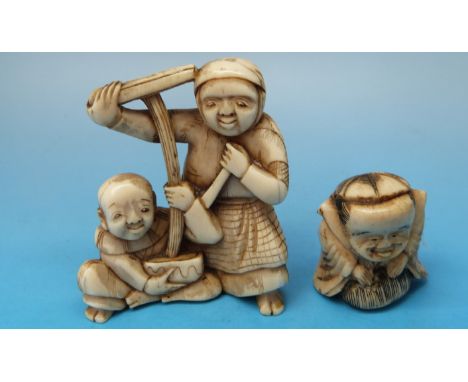 A Japanese ivory okimono of a washer woman and a boy together with a bone netsuke