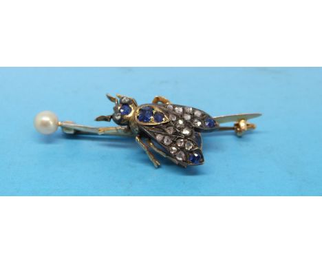 A gold brooch set with a diamond and sapphires in the form of a bee and a pearl to one end