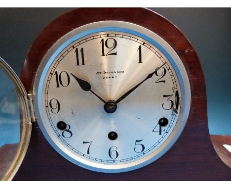 A Mitre cased 1930s two train mantel clock with silvered dial, together with a three train Napoleon hat example with dual chi