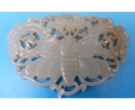 A Chinese celadon jade butterfly pendant with openwork carving and pale russet inclusion (6.4cm wide)