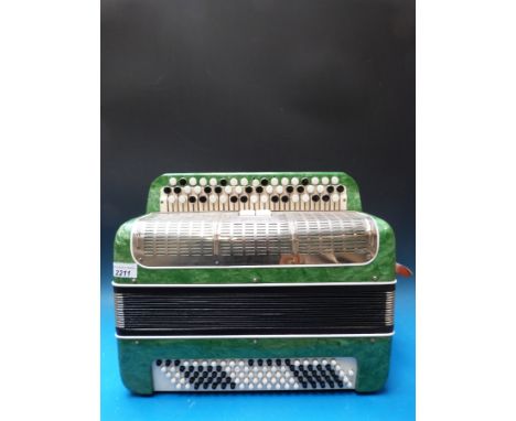 An early 1960s chromatic three row button accordion, Russian made 'Melody' 100 bass buttons, 52 treble buttons, two couplers,