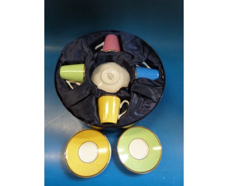 A boxed Royal Worcester harlequin coffee set celebrating The Queen's 80th birthday