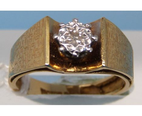 An 18ct gold ring set with a diamond in an illusion setting (size K)