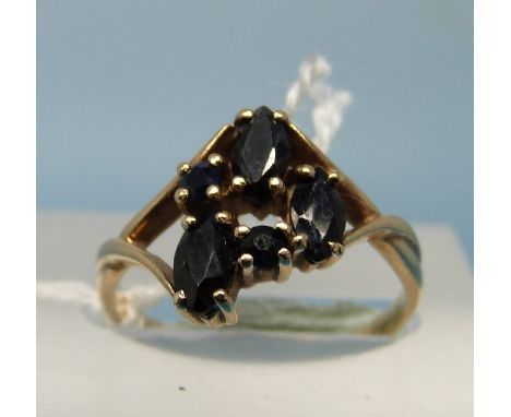 A 9ct gold ring set with three oval and two circular sapphires (size K)